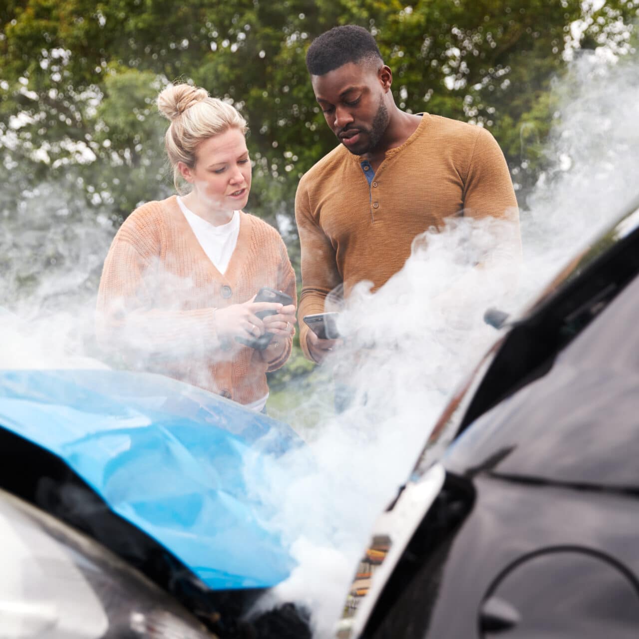 Two Motorists Swapping Insurance Details On Mobile Phone After Car Crash